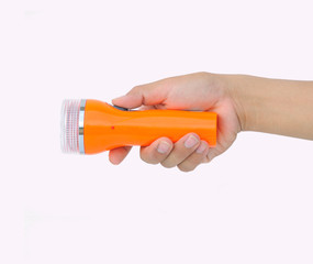 Hand holding a small flashlight