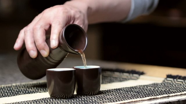 Pouring Saki liquor