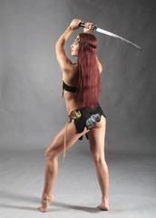 Fototapeta na wymiar warrior woman holding sword in her hand