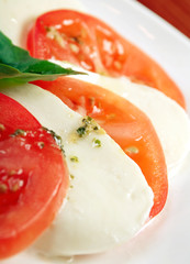 Arrangement of mozzarella and tomatoes