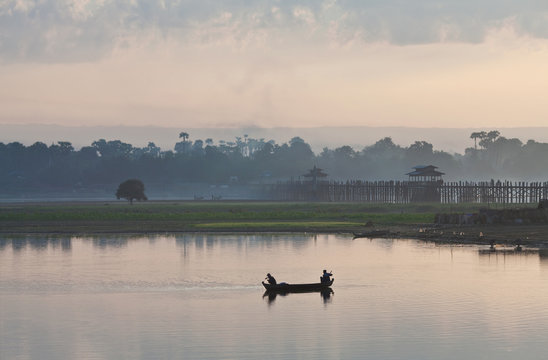 Silhouettes of fishermen on the Taungthaman lake, Myanmar