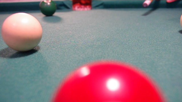Balls on green billiards table