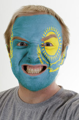 Face of crazy angry man painted in colors of kazakstan flag