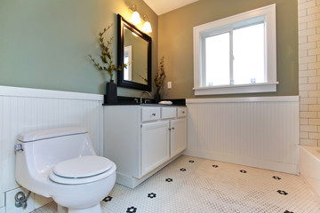 Fototapeta na wymiar New green bathroom with white ceramic