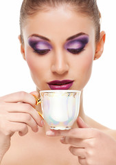 Beauty portrait with cup of tea