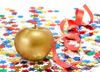 Gold apple with a red ribbon