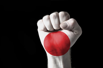 Fototapeta premium Fist painted in colors of japan flag