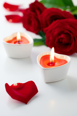 candles and red roses for Valentine's Day