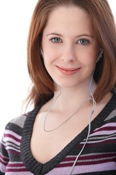 Portrait of young woman with headphones smiling