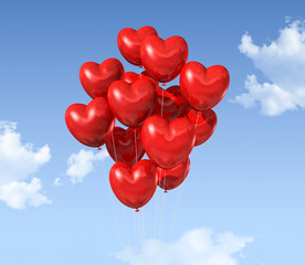 Fototapeta na wymiar red heart shaped balloons floating in the sky