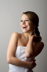 beautiful young woman in evening dress laughs