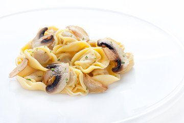 Tortellini dish with mushrooms and garlic sauteed