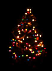 Abstract christmas tree over black background