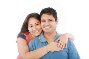 Fototapeta premium Portrait of a beautiful young happy smiling couple - isolated