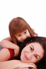 Fototapeta na wymiar A portrait of a mother and her baby girl lying on the floor and
