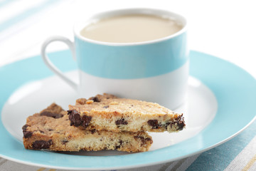 Shortbread with chocolate chips and tea with milk
