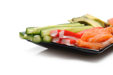 ingredients for sushi making. salmon, cucumber, avocado, shrimps