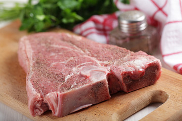 Raw T-bone steak