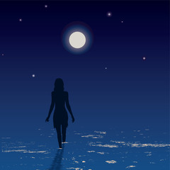Silhouette of young woman walking on a sea