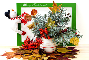 Christmas tree decorated with autumn leaves  on white background