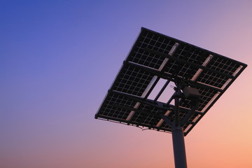 silhouette of solar panel with beautiful sunset