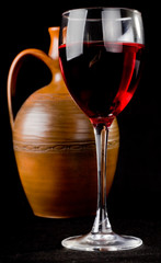 Pitcher and a glass of red liquid