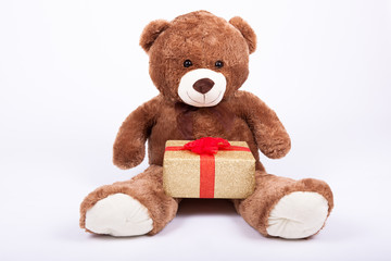 Seated   teddy bear with gift boxes