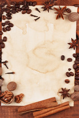 old paper for recipes and spices on wooden table