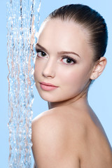 Naklejka premium Beautiful woman and stream of water