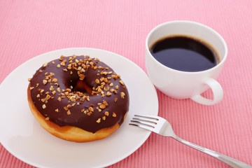 sweet chocolate donut with a cup of coffee