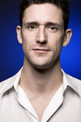 Handsome man on dark background.
