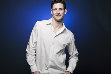 Happy young businessman in white shirt.