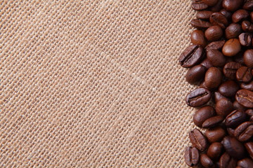 Coffee beans on linen background