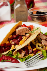 Chili bean and tuna salad in taco shells