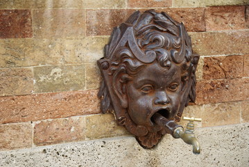 fountain with angle face in Montalto Marche, Italy