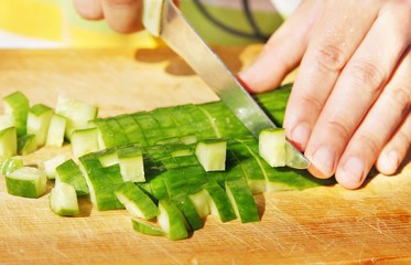 Cutting of cucumber for salad