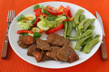 beef with sausages, beans and salad