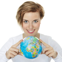Young woman holding a globe in her hands