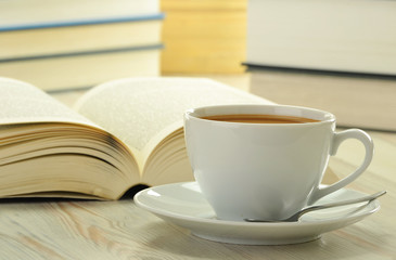 Books and cup of coffee on the table