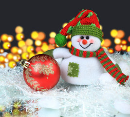 Festive snowman with Christmas light background