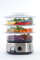 steam cooker with vegetables and fish