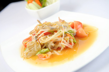 spicy papaya salad with raw blue crab