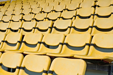 Fototapeta na wymiar Yellow Seat Pattern in Football Stadium