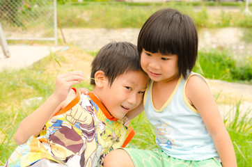 Asian girl hug her brother with love