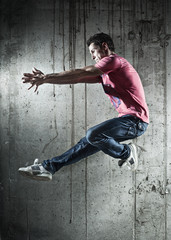 Young man dancer jumping
