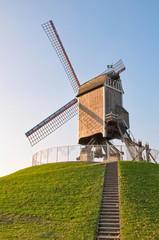 Wind mill with low sunlight at Brugge - Belgium