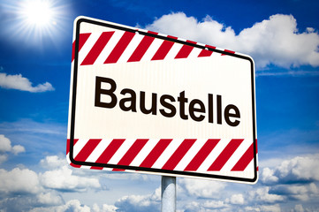 Ortseingangsschild mit Baustelle