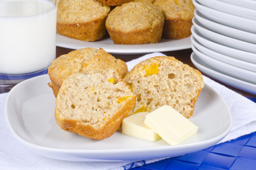 Homemade Peach Muffins Served with Butter and Milk