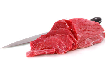 Cut of  beef steak  with knife  Isolated.