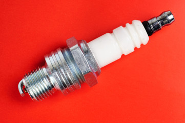 spark-plug on the red background